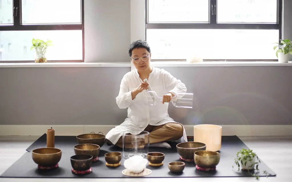 A sound bath session with Tibetan singing bowls and crystal sing bowls with Anita